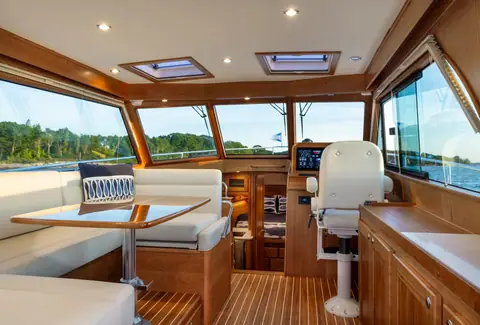 Sabre 38 Salon Express salon with dinette, cherry joinery and helm seat forward