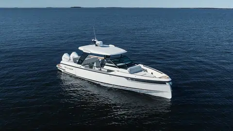 Saxdor 320 GTO idling on dark open water seen from the bow quarter