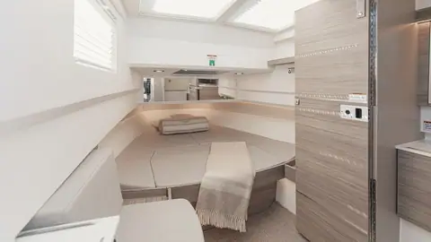 Saxdor 340 GTWA forward cabin with a large berth and light wood joinery