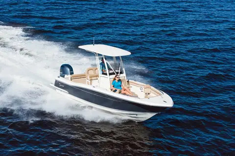 Scout 215 XSF center console running at speed with a T top and single Yamaha outboard