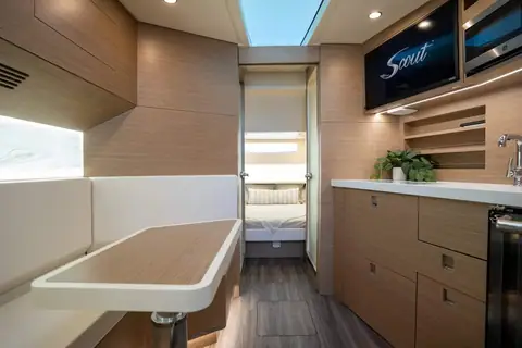 Cabin of the Scout 530 LXF with a dinette, galley cabinets and a skylight