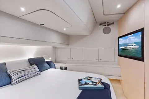 Stateroom aboard the Scout 670 LXS with a double berth and flat screen