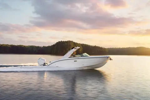 Sea Ray SDX 270 Outboard running in profile at sunset