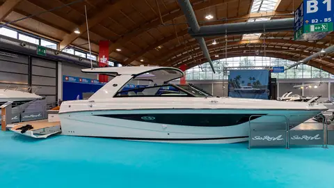 Side view of a Sea Ray SLX 400 at a boat show