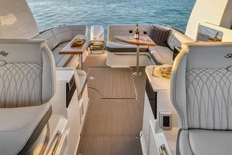 Sea Ray Sundancer 370 Outboard cockpit with teak floor, aft lounge and dinette table