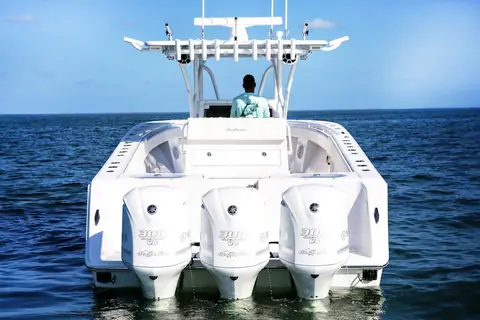SeaHunter 33 Tournament seen from astern with triple Yamaha outboards on the transom