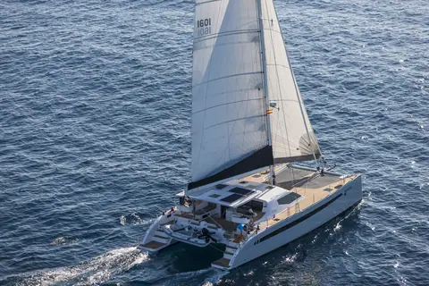 Seawind 1600 seen from above sailing upwind with solar panels on the coachroof