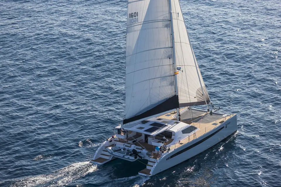 Seawind 1600 seen from above sailing upwind with solar panels on the coachroof