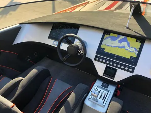 Skater 388 helm with a sport wheel, chart display and throttle controls