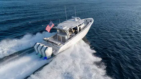Solace 42CS seen from the stern quarter at speed with quad outboards on the transom