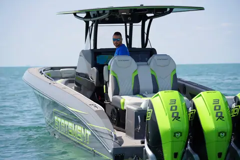 Statement 350 Open seen from astern showing helm seats, T top and Mercury Racing 300R outboards