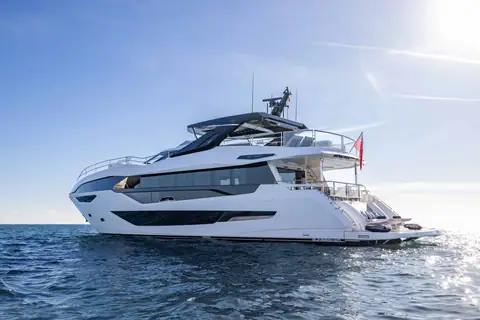 Sunseeker 100 Yacht seen from the bow quarter showing its long window line and flybridge
