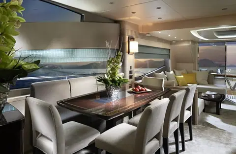 Sunseeker 75 Yacht Mk2 main deck dining table beside the saloon windows