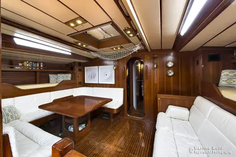 Saloon table and settees inside a Swan 65