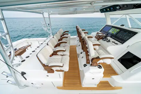 Valhalla V55 helm deck with rows of helm and companion seats on a teak sole under the hardtop