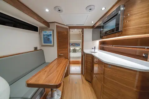 Valhalla V55 cabin with teak dinette, galley counter and satin wood joinery