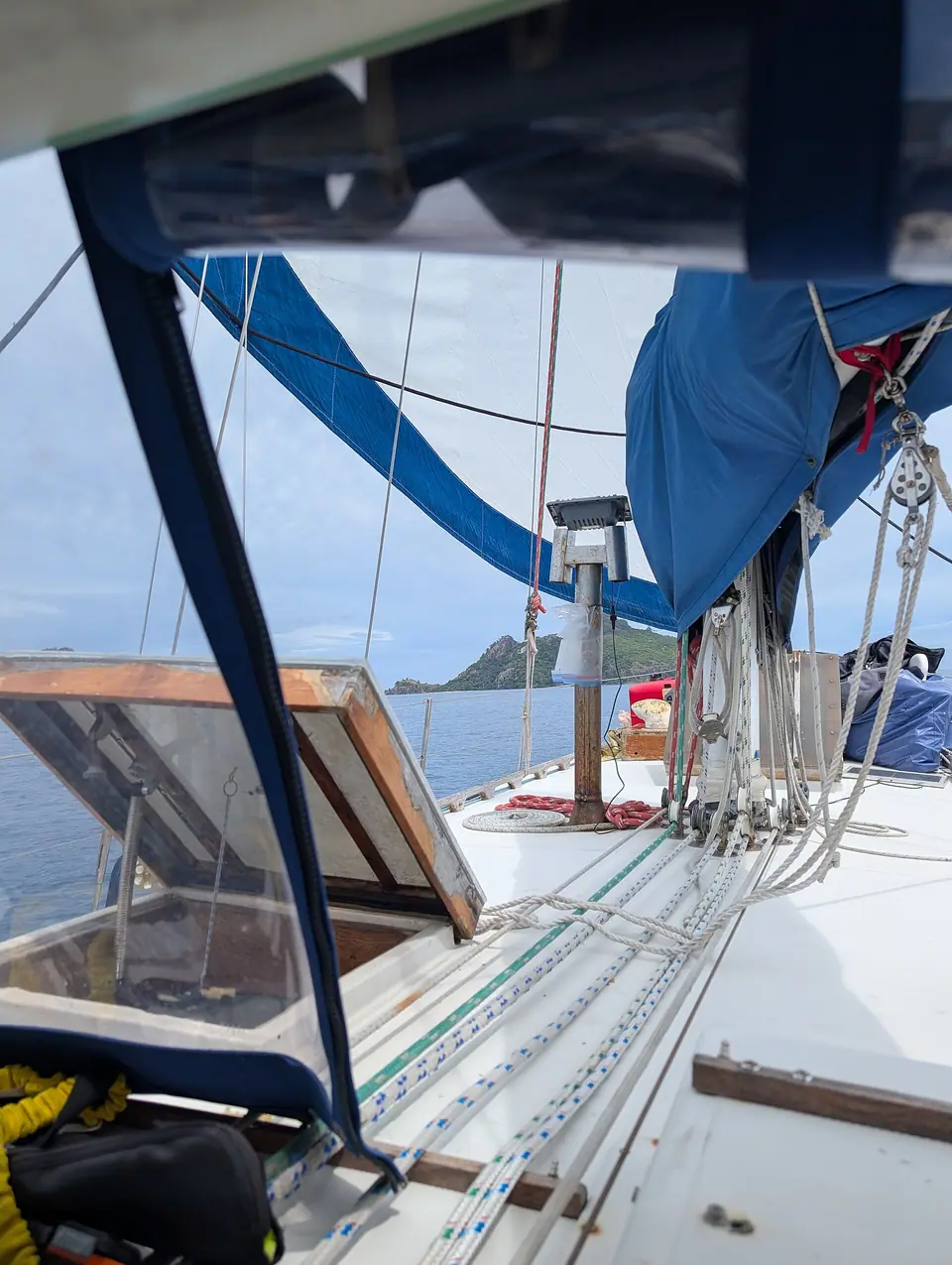 Deck and open hatch of a Valiant 40 sailing near Fiji
