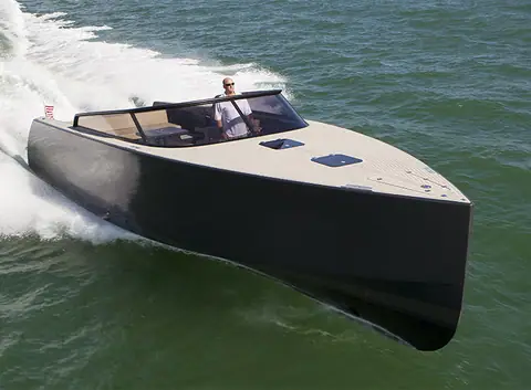 Dark-hulled VanDutch 40 carving through the water