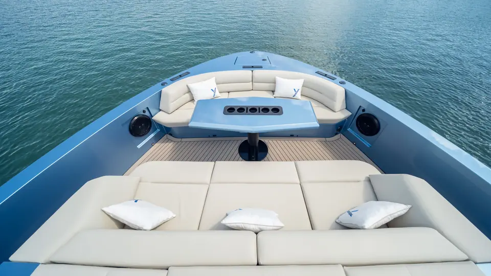 Vanquish VQ58 bow lounge with a sun pad, wraparound seating and a central table