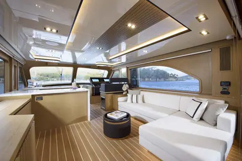 Vicem 65 Classic salon with white L shaped sofa, galley counter and helm forward