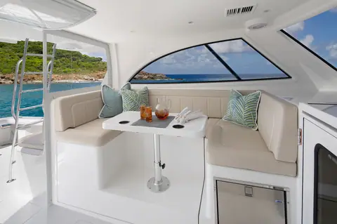 Viking 38 Billfish bridge deck with L shaped settee, dinette table and windshield views