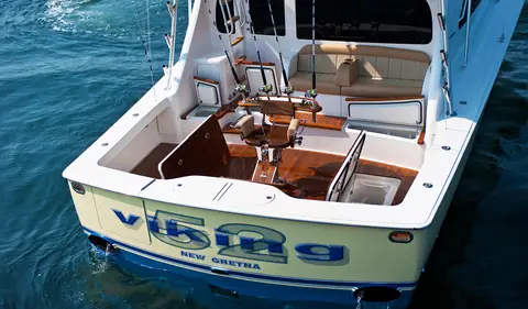 Viking 52 Convertible cockpit with a teak fighting chair, seen over the transom