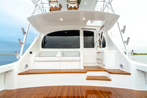 Viking 54 Convertible teak cockpit with mezzanine seating, salon door and flybridge ladder