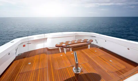 Viking 58 Convertible teak cockpit with a rocket launcher and fighting chair pedestal