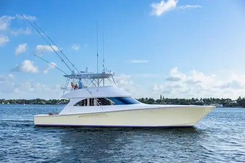 2008 Viking 60 Convertible with a flybridge hardtop and outriggers cruising slowly in profile
