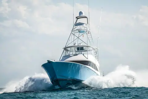 Viking 60 Convertible with a tuna tower running bow on through spray
