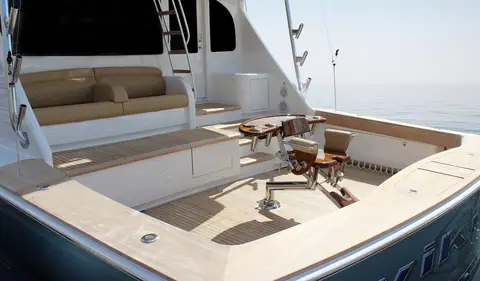 Viking 72 Convertible cockpit with a fighting chair, mezzanine seating and teak covering boards
