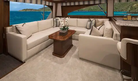 Viking 72 Convertible salon with an L shaped settee, walnut joinery and galley forward