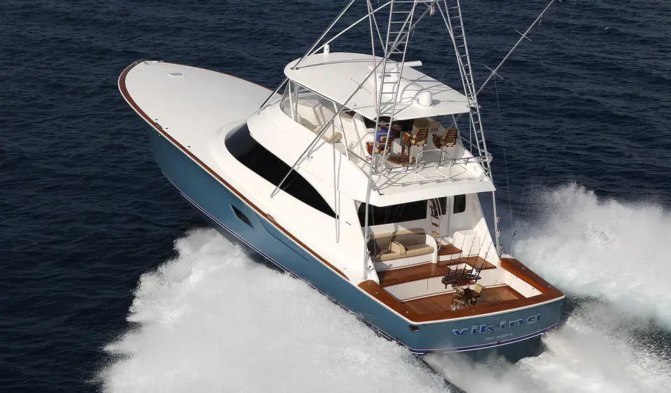 Viking 80 Convertible seen from astern and above at speed, showing the teak cockpit and flybridge