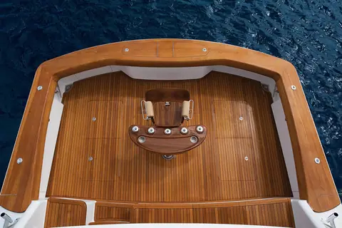 Overhead view of the Viking 80 Convertible teak cockpit with a fighting chair and teak covering boards