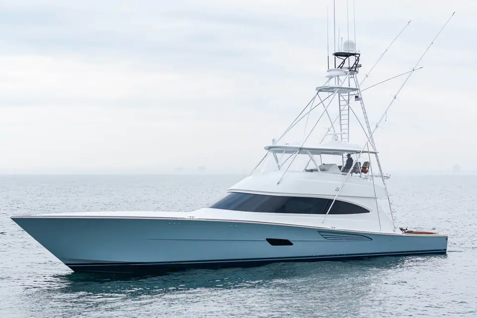 White Viking 82 Convertible sportfish yacht in profile underway on a calm gray sea