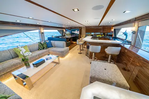 Viking 90 Convertible salon with an L shaped sofa, bar stools and large side windows