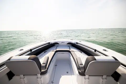 Yellowfin 26 Hybrid bow seating with gray cushions and backrests looking forward