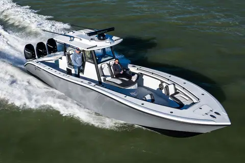 Gray Yellowfin 36 Offshore with triple outboards running, seen from above